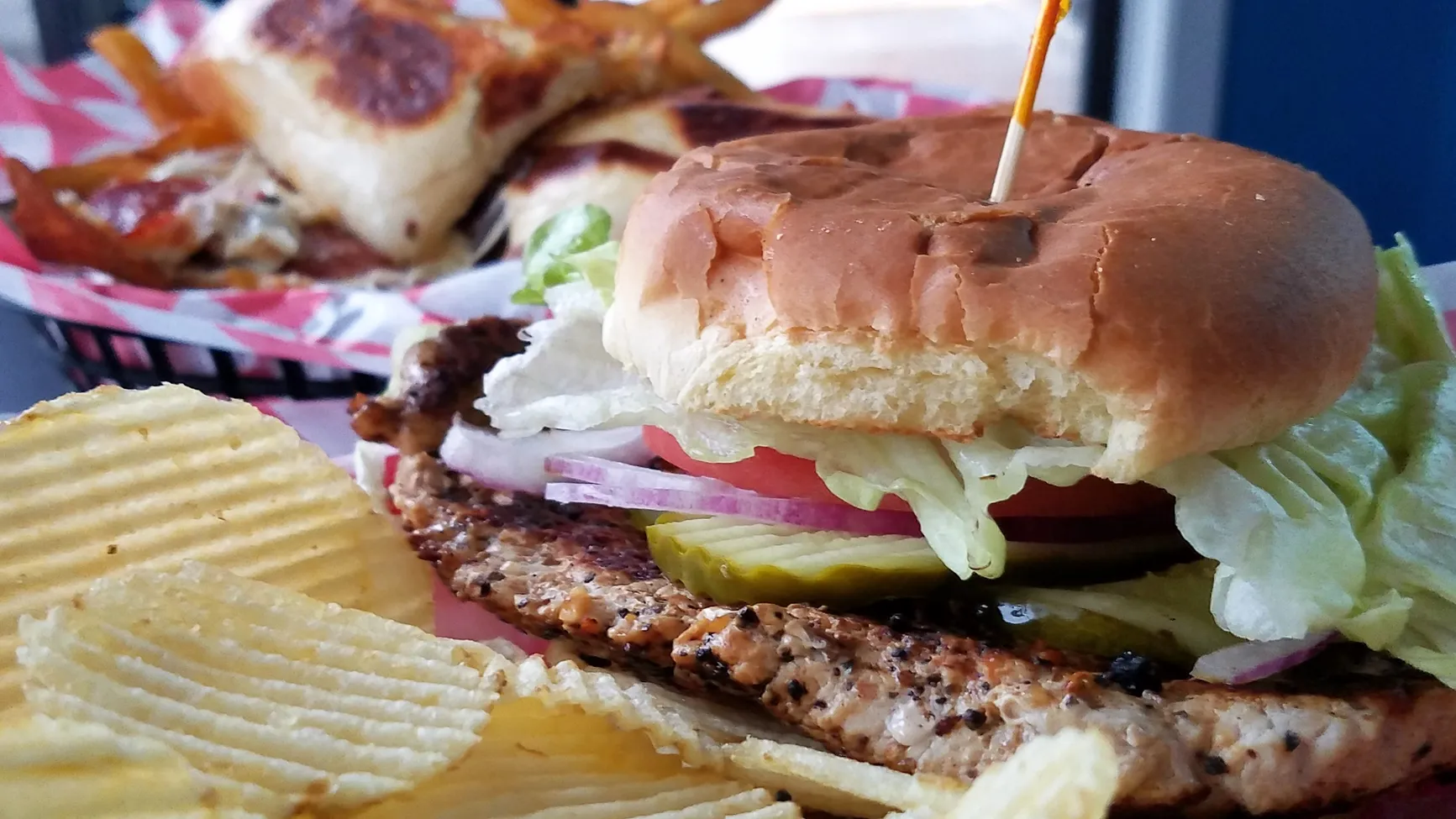Pistons Bar and Grill signature dishes Pistons BurgerBreaded Tenderloin SandwichChicken WingsLoaded Nachos